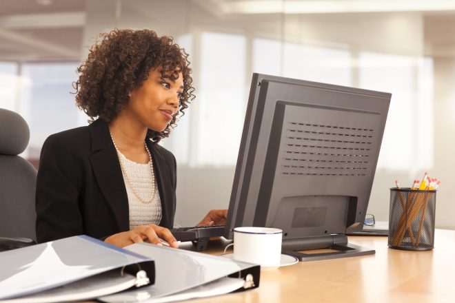 A woman reviewing her incurred cost submission