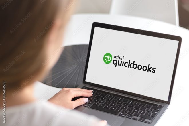A woman using Quickbooks, an accounting software.