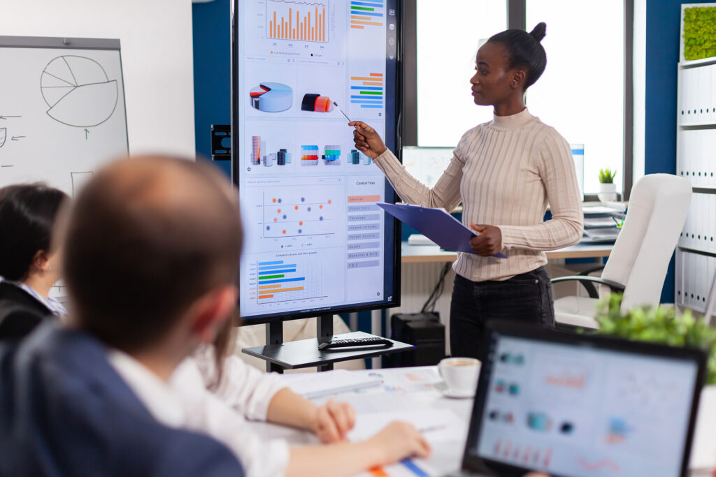 Business woman giving presentations. A lot of focus and reporting.